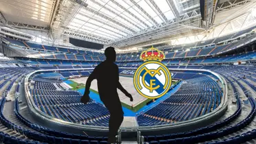 The Santiago Bernabeu is empty while a mystery player is next to the badge of Real Madrid.