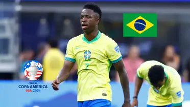 Vinicius Jr. walks on the pitch with a Brazil jersey while the Brazil flag is on the top and the Copa America logo is on the bottom. (Source: Getty Images, CONMEBOL)