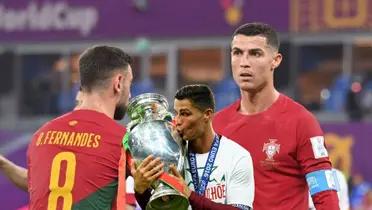 Cristiano Ronaldo and Bruno Fernandes in the 2022 World Cup while Ronaldo kisses the 2016 Euro trophy.