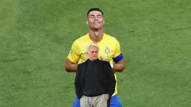 Cristiano Ronaldo celebrates with his "sleep" celebration while Jose Mourinho looks serious as a coach.