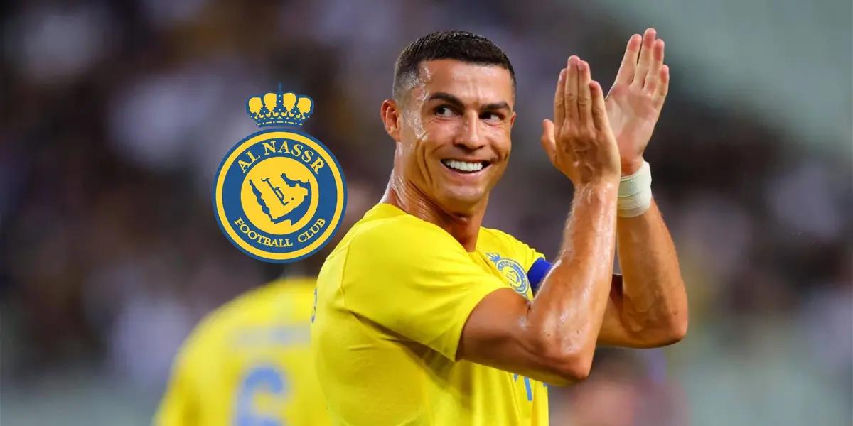 Cristiano Ronaldo claps his hands with a smile on his face wearing an Al Nassr shirt on.