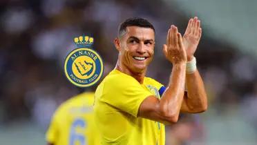 Cristiano Ronaldo claps his hands with a smile on his face wearing an Al Nassr shirt on.