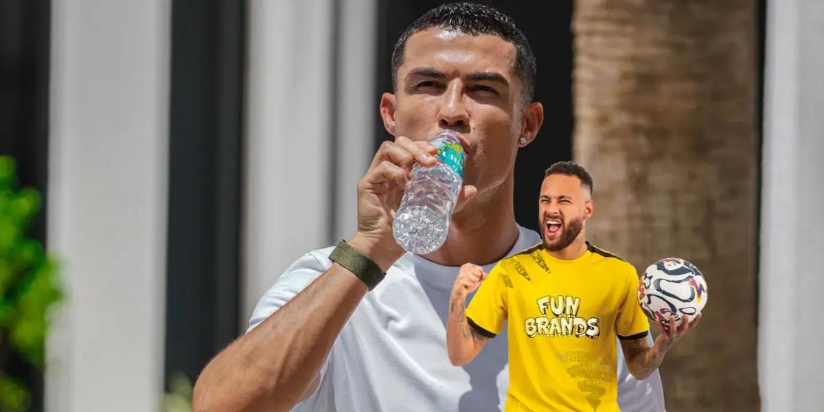 Cristiano Ronaldo drinks water while Neymar celebrates with a ball on his hand.