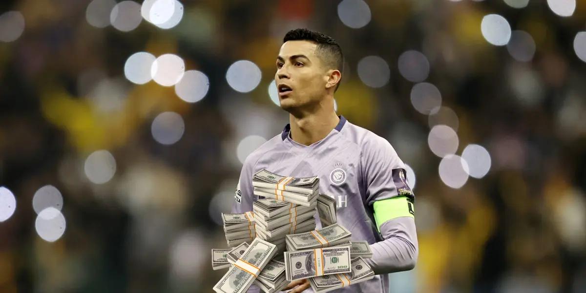 Cristiano Ronaldo on the pitch wearing an Al Nassr jersey while a stack of money is below him.