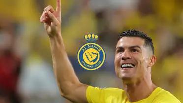 Cristiano Ronaldo points up with an Al Nassr jersey and an Al Nassr badge is in the middle.