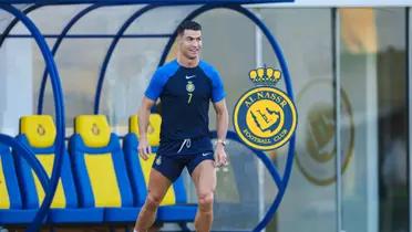 Cristiano Ronaldo wears an Al Nassr training kit while the Al Nassr badge is next to him.