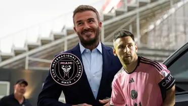 David Beckham smiles wearing a suit while Lionel Messi turns to the side wearing an Inter Miami jersey; the Inter Miami logo is on the left side.