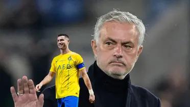 Jose Mourinho puts his hand up with a serious face and Cristiano Ronaldo smiles while wearing an Al Nassr jersey.