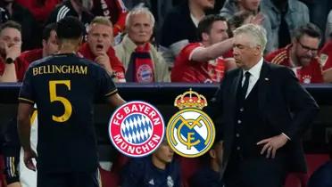 Jude Bellingham walks to the bench and shakes Carlo Ancelotti's hand.