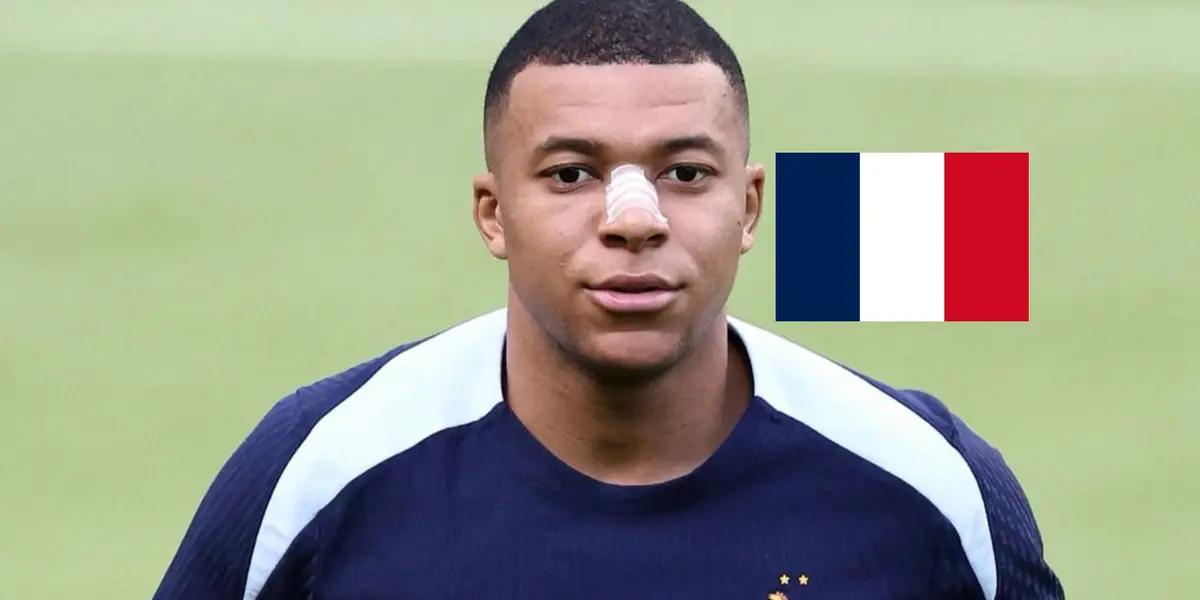 Kylian Mbappé is wearing the training kit while wearing a nose protection and the the French flag is next to him. (Source: KM10 Zone)