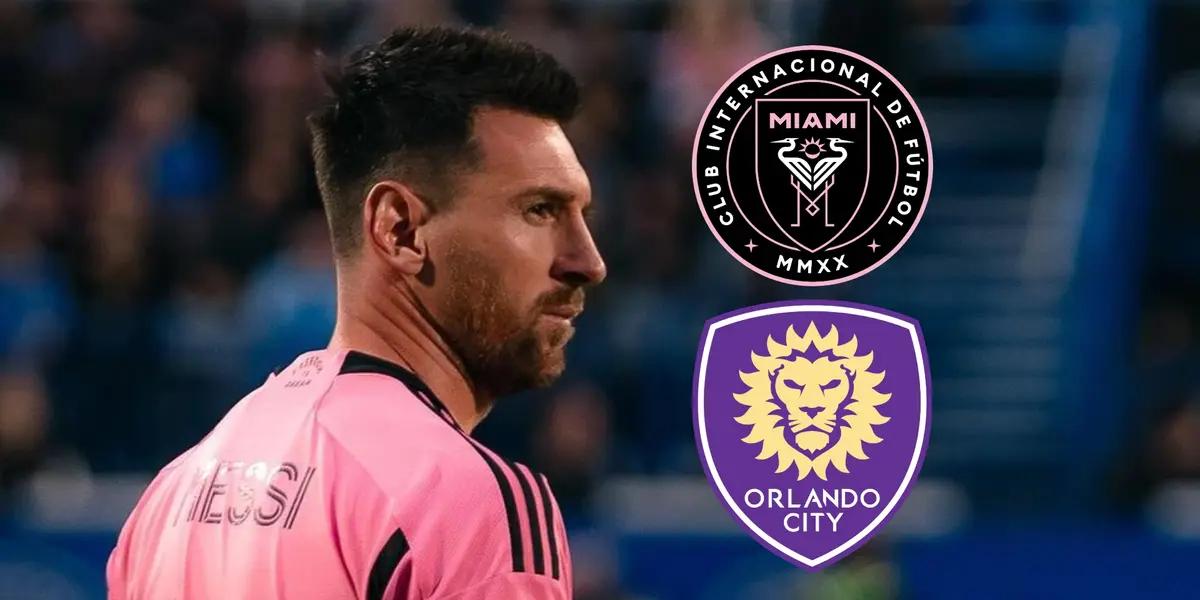Lionel Messi wearing the Inter Miami jersey and looking towards the logos of Inter Miami and Orlando City.