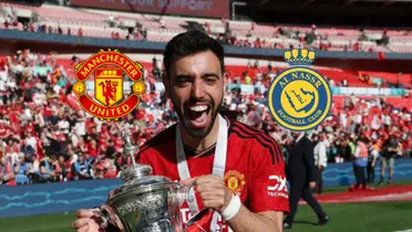 Bruno Fernandes celebrates with the FA Cup trophy; the Manchester United and the Al Nassr badges are next to him.