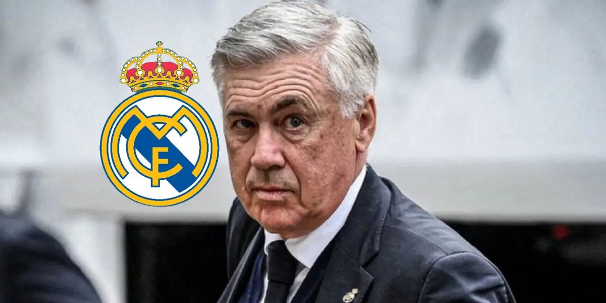 Carlo Ancelotti looks at the camera while wearing a suit and the Real Madrid logo is next to him.