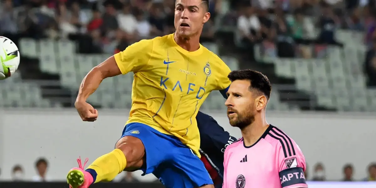 Cristiano Ronaldo looks at the ball while wearing the Al Nassr jersey and Lionel Messi stares while wearing the Inter Miami jersey.