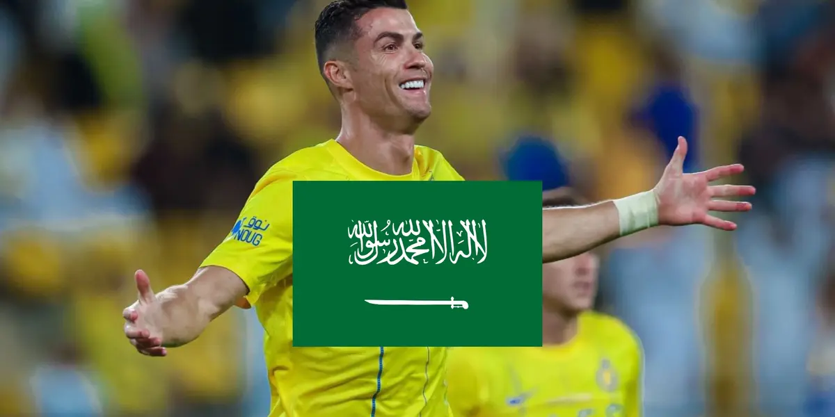 Cristiano Ronaldo opens his arms with a smile on his face while wearing the Al Nassr shirt.