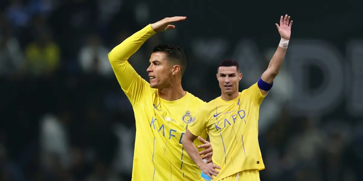 Cristiano Ronaldo put his hand up in anger and he also raises his hand with an Al Nassr shirt.