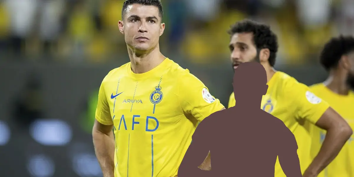 Cristiano Ronaldo puts his hand on his hips while wearing the Al Nassr jersey and a mystery player is below him.