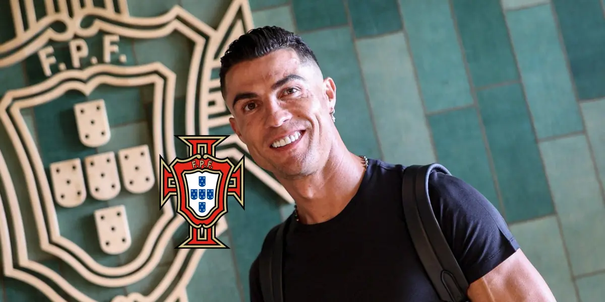 Cristiano Ronaldo smiles as he arrives to the Portugal national team facilities and the Portugal national team badge is next to him.