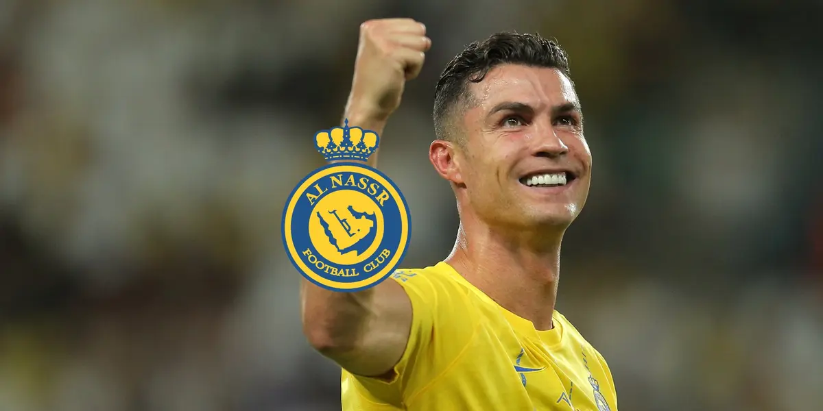 Cristiano Ronaldo smiles with his fist up and the Al Nassr badge is next to him.