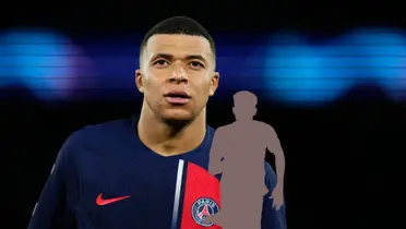 Kylian Mbappé looks up while he wears the PSG shirt.