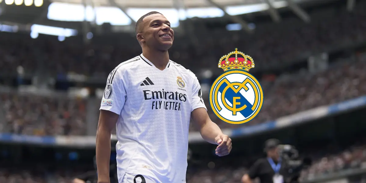 Kylian Mbappé smiles as he walks wearing the Real Madrid jersey and the Real Madrid badge is next to him. (Source: Getty Images)