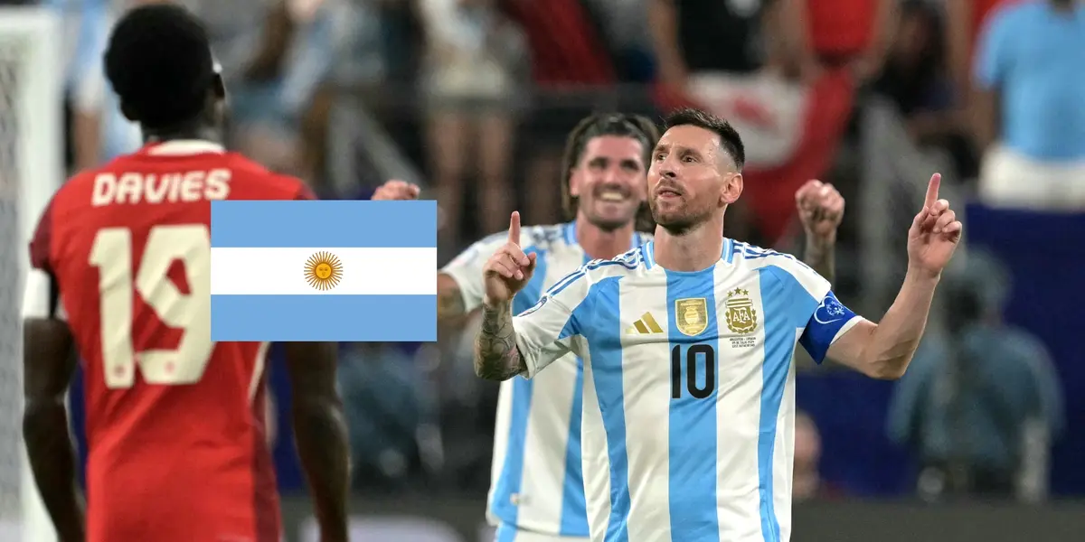 Lionel Messi celebrates his goal for Argentina as he wears the national team jersey while the Argentina flag is next to him. (Source: Getty Images)