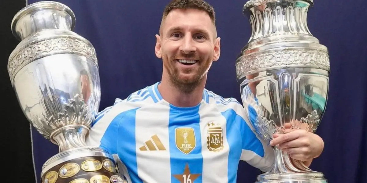 Lionel Messi smiles as he holds two Copa America trophies with the Argentina jersey on. (Source: Lionel Messi Instagram)