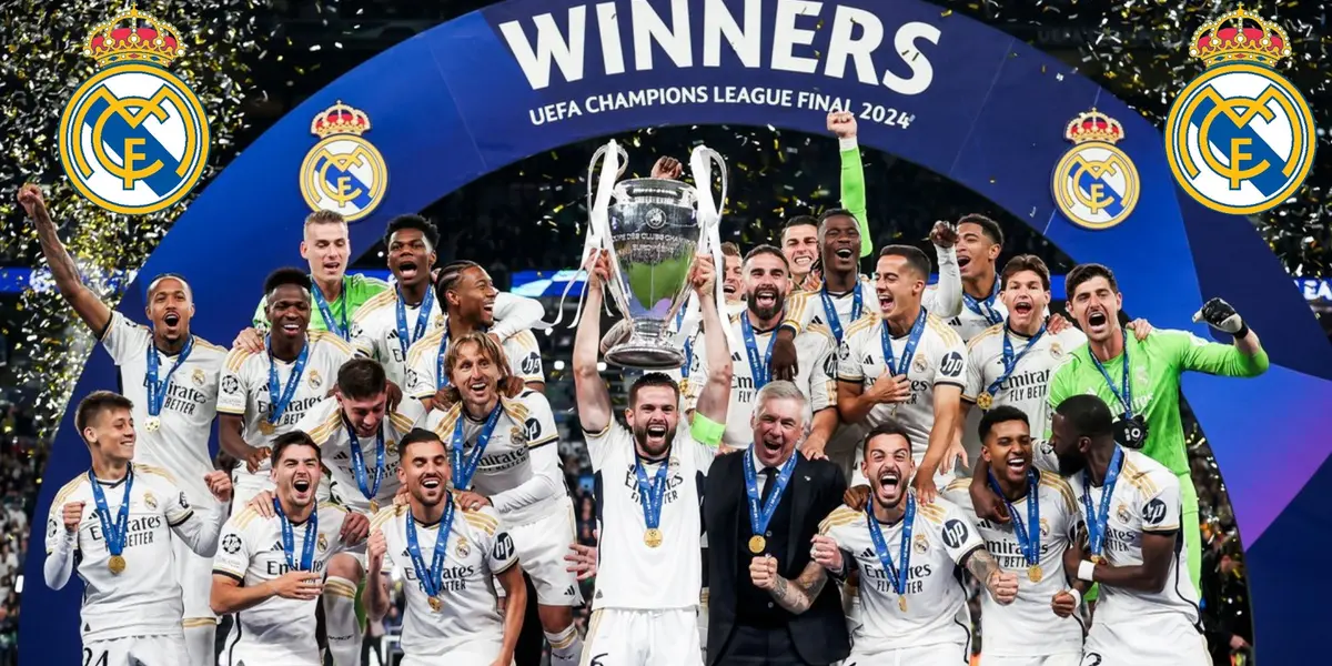 The Real Madrid team celebrate the Champions League trophy as Nacho Fernandez lifts the trophy.