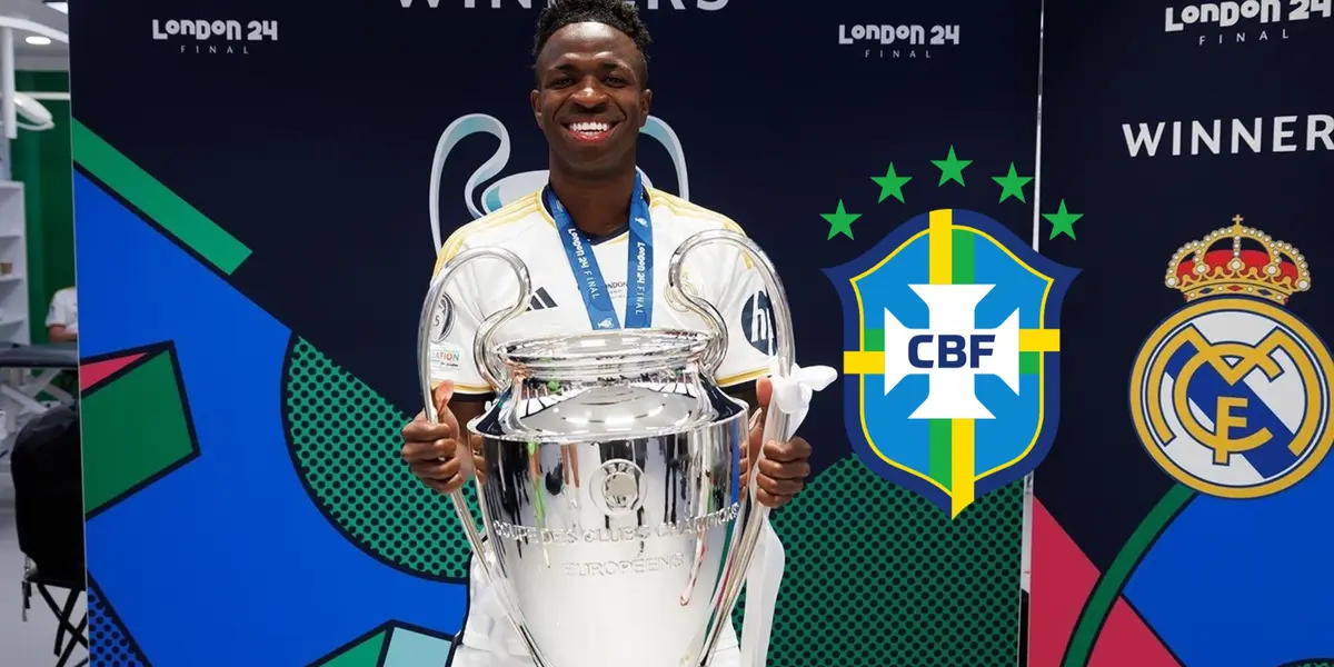 Vinicius Jr. smiles while holding the Champions League trophy while the Brazilian national team badge is next to him.