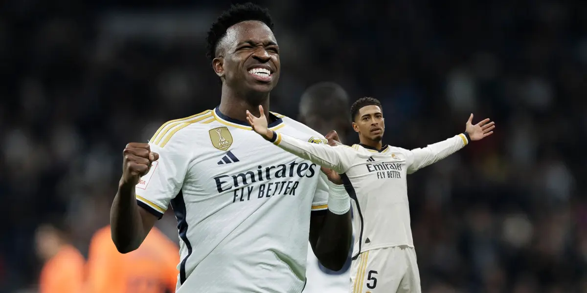 Vinicius Jr smiles while showing the Real Madrid badge on his jersey and Jude Bellingham does his trademark celebration while wearing the Real Madrid jersey.