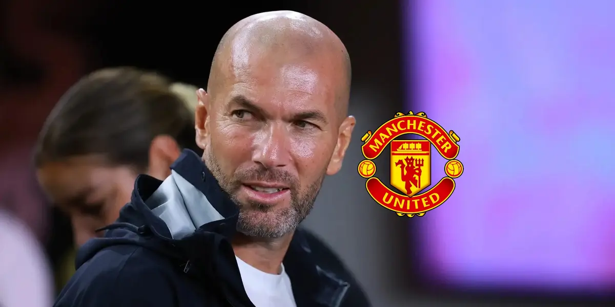 Zinedine Zidane looks to his right while the Manchester United logo is next to him.